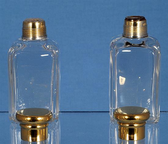 An Edwardian silver mounted glass scent bottle & a pair of scent bottles.